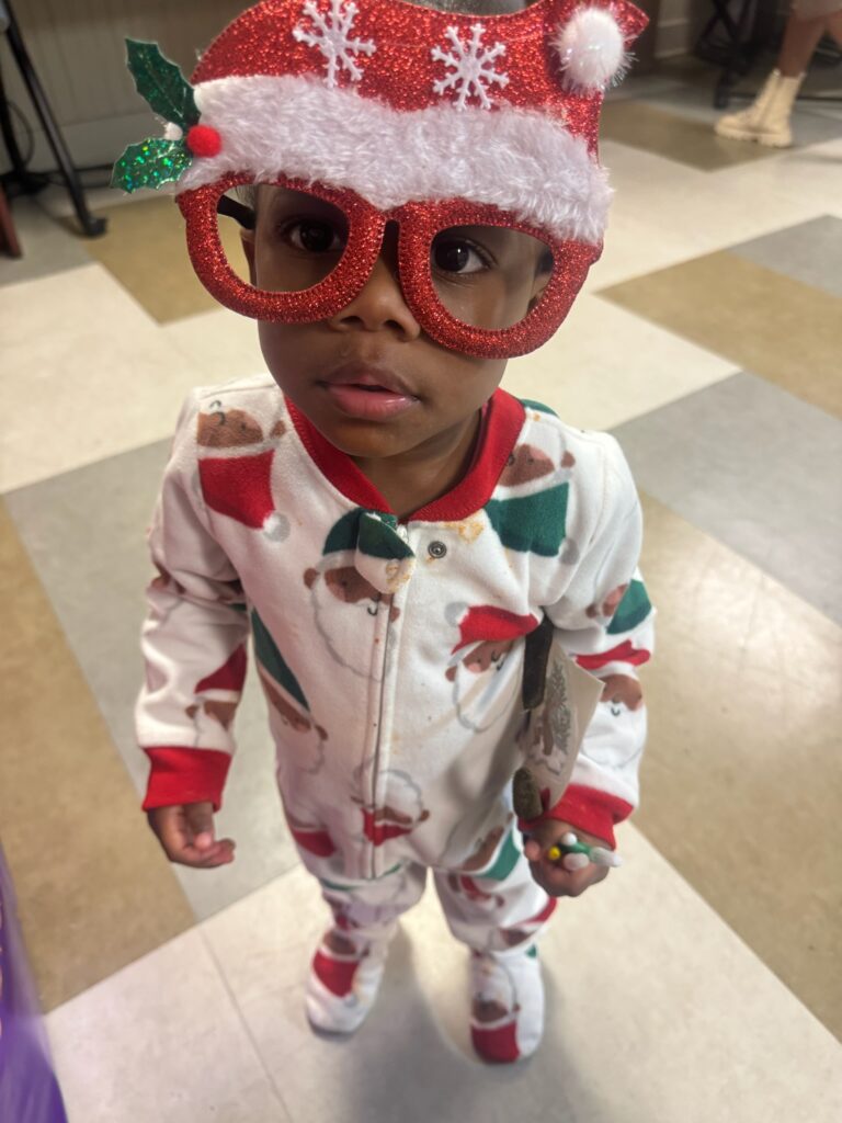 The SAGE Center was filled with holiday cheer as families came together to celebrate the season with laughter, games, and delicious food. The event created a joyful and welcoming space for connection, reflection, and shared celebration. We extend our heartfelt thanks to Tijuana Jones, Housing Case Manager, for generously providing food for all to enjoy, and to Dr. Gainers and her Delta Sorority sisters for their extraordinary generosity. From thoughtful gifts to luxury items, including designer coats and jewelry, their contributions helped make this holiday season truly memorable for the families we serve. Thank you to everyone who played a role in making this celebration so special. Your kindness and support continue to strengthen our community and bring joy to our families.